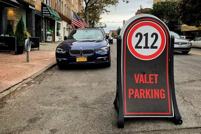 Sofia’s valet service used a board to block off multiple spots across the street from their restaurant.